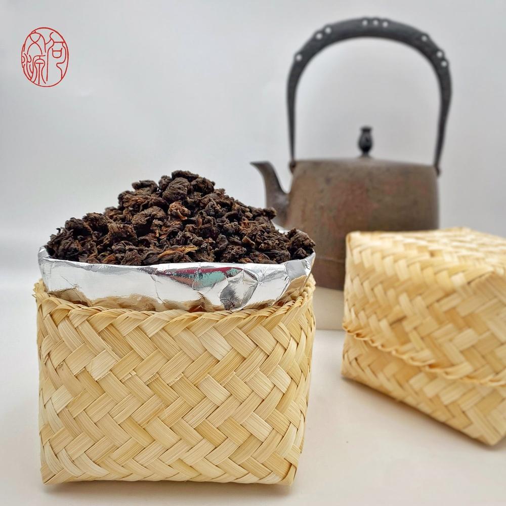Royal Tips naturally formed ripe Pu-erh tea heads in bamboo basket with iron kettle — why ripe Pu-erh forms natural tea heads guide