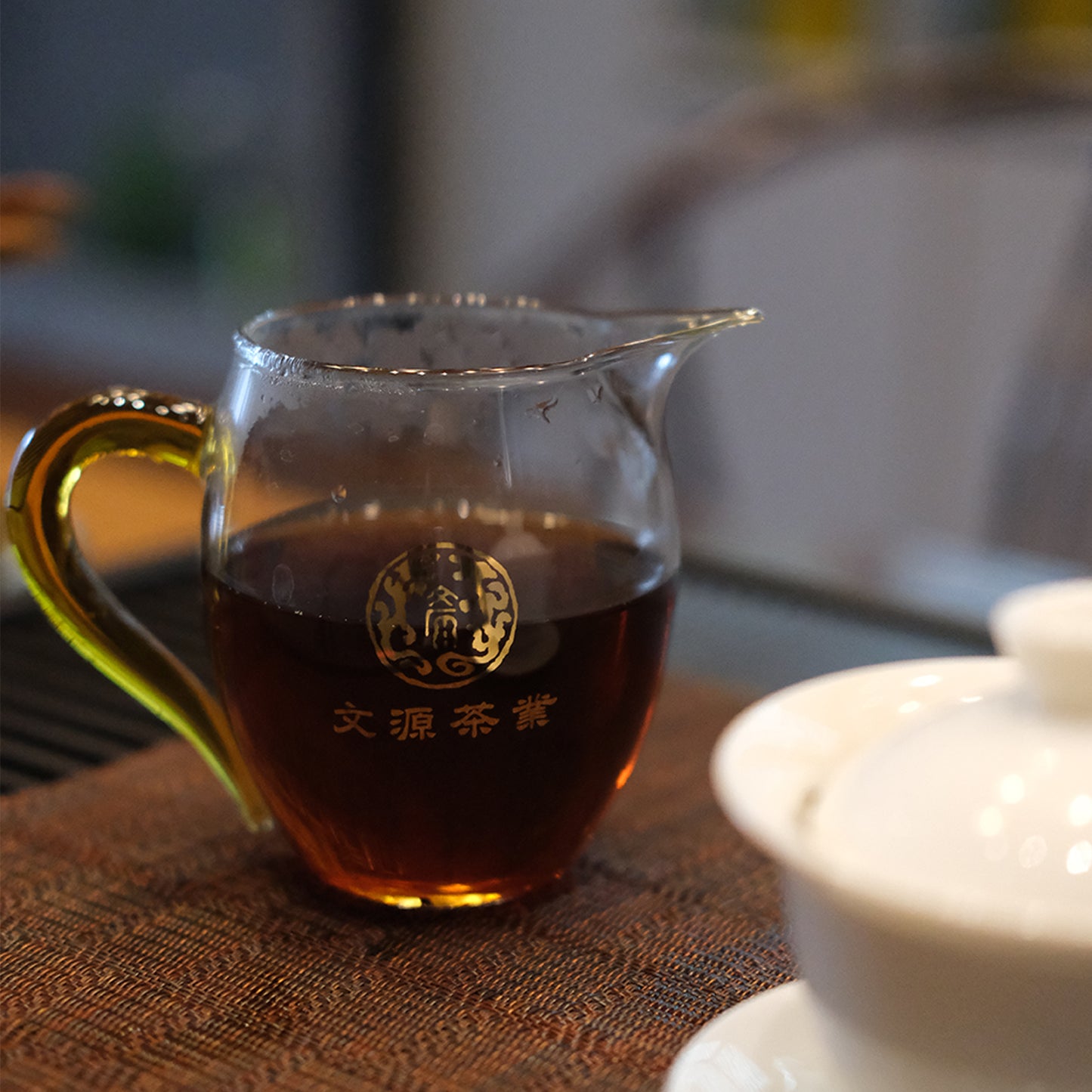 Antrilea Pu-erh Tea brewing experience with traditional glass teapot and tea cup