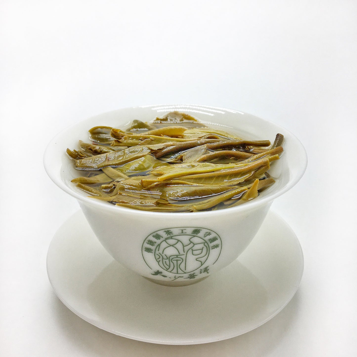 Antrilea Yunnan Pu-erh Tea tasting collection with loose tea leaves and brewed tea